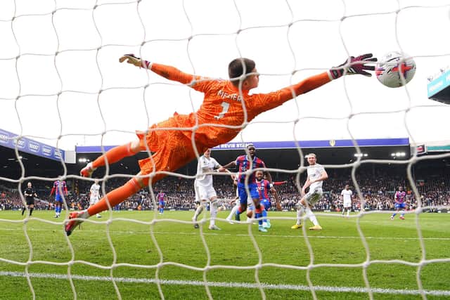 LEEDS, ENGLAND - APRIL 09: Jordan Ayew of Crystal Palace scores the team's second goal against Illan Meslier of Leeds United during the Premier League match between Leeds United and Crystal Palace at Elland Road on April 09, 2023 in Leeds, England. (Photo by Stu Forster/Getty Images)