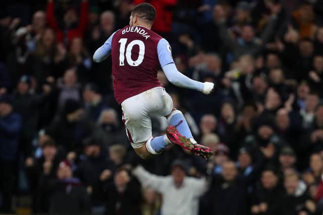 Aston Villa's Argentinian midfielder Emiliano Buendia celebrates after a VAR (Video Assistant Referee) review allows his goal, Villa's second, to stand during the English Premier League football match between Aston Villa and Leeds Utd at Villa Park in Birmingham, central England on January 13, 2023. (Photo by GEOFF CADDICK/AFP via Getty Images)