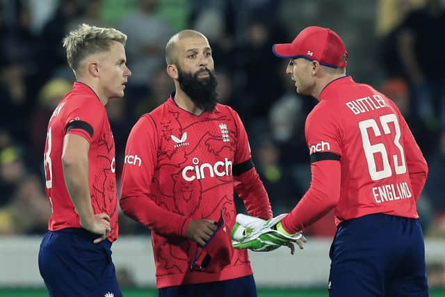 PLACEMENT: England's Sam Curran sorts his field with the help Moeen Ali  and Jos Buttler during Game Two against Australia in Canberra. Picture: Mark Evans/Getty Images