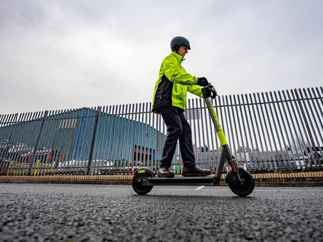 Stock image of a man riding an e-scooter. Picture: John Devlin
