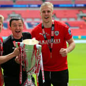 MAGIC DAY: Barnsley's Lloyd Isgrove, manager Paul Heckingbottom and Marc Roberts celebrate with the League One play-off trophy after beating Millwall at Wembley ion May 2016. Picture: Nigel French/PA