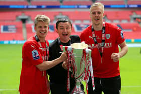 MAGIC DAY: Barnsley's Lloyd Isgrove, manager Paul Heckingbottom and Marc Roberts celebrate with the League One play-off trophy after beating Millwall at Wembley ion May 2016. Picture: Nigel French/PA