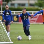 KEY FIGURES: Harry Maguire (right) and Kalvin Phillips (centre) training with England