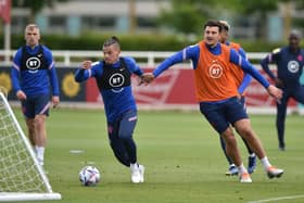 KEY FIGURES: Harry Maguire (right) and Kalvin Phillips (centre) training with England