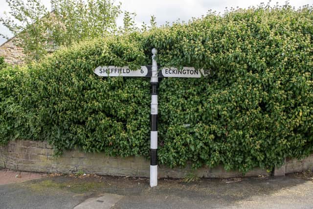 Feature on South Yorkshire village Mosborough near Sheffield photographed by Tony Johnson for The Yorkshire Post.  
Fingerpost for Sheffield and Eckington in the centre of the village.