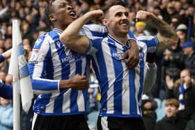 GOAL RETURN: Sheffield Wednesday's Lee Gregory celebrates his strike with Dennis Adeniran in Saturday's 5-2 win against Milton Keynes Dons, a victory which took the Owls back to the top of the League One table. 
Steve Ellis