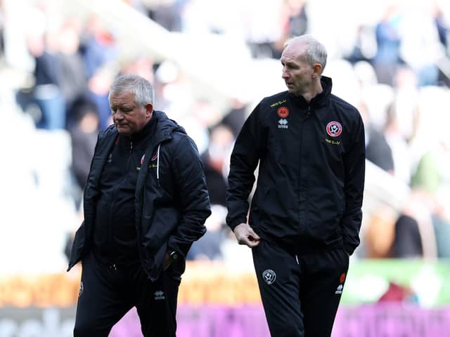 NEWCASTLE UPON TYNE, ENGLAND - APRIL 27: Chris Wilder, Manager of Sheffield United (L), looks dejected after the team's defeat, which confirms Sheffield United's relegation from the Premier League, in the Premier League match between Newcastle United and Sheffield United at St. James Park on April 27, 2024 in Newcastle upon Tyne, England. (Photo by Ian MacNicol/Getty Images)