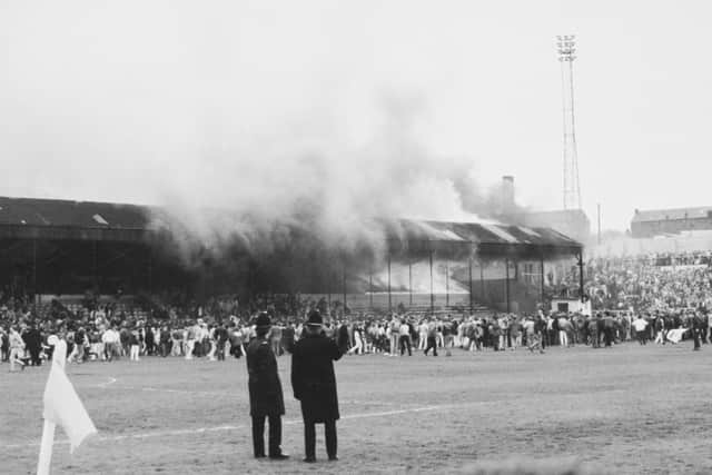 TRAGEDY: Fire takes hold of the main stand at Bradford City's Valley Parade on May 11, 1985