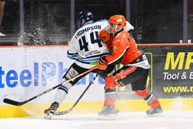 BACK IN THE GAME: Brett Neumann, right, battles for possession in the 4-1 win over Coventry Blaze on Sunday. Picture: Dean Woolley/Steelers Media.