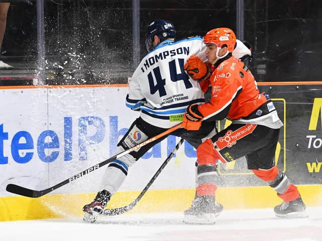 BACK IN THE GAME: Brett Neumann, right, battles for possession in the 4-1 win over Coventry Blaze on Sunday. Picture: Dean Woolley/Steelers Media.