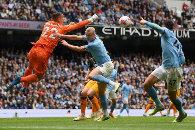 PREMIER LEAGUE DEBUT: Joel Robles, playing league football for Leeds for the first time, is challenged by Erling Haaland of Manchester City