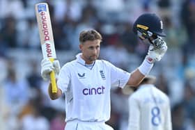 LEADING MAN: England batsman Joe Root celebrates his century during day one of the 4th Test Match against India in Ranchi