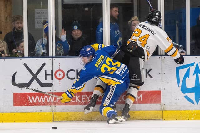 DERBY DATE: Finn Bradon and Brock Bartholomew clash on the boards during Friday night's NIHL National Cup clash at Elland Road Ice Arena. Picture: Bruce Rollinson
