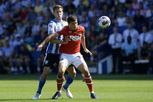 MIDFIELD BATTLE: Sheffield Wednesday's Will Vaulks closes down Eoghan O'Connell of Charlton Athletic