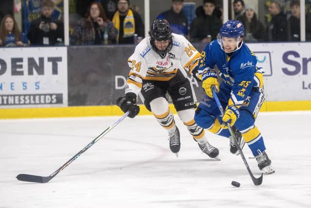 DERBY DUEL: Hull Seahawks' Brock Bartholomew and Leeds Knights' Mac Howlett battle for the puck at Elland Road Ice Arena Picture: Bruce Rollinson