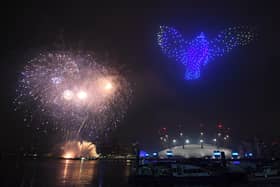 Fireworks and drones illuminate the night sky over London on New Year's Eve in 2020. PIC: Victoria Jones/PA Wire