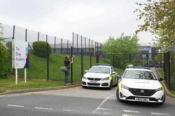 Police outside the Birley Academy in Sheffield, South Yorkshire, where a 17-year-old boy has been arrested on suspicion of attempted murder. A child was assaulted and two adults suffered minor injuries in the incident.  Dominic Lipinski/PA Wire