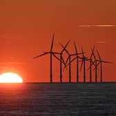 The sun sets behind the Burbo Bank Offshore Wind Farm in Liverpool Bay in the Irish Sea. PIC: PAUL ELLIS/AFP via Getty Images