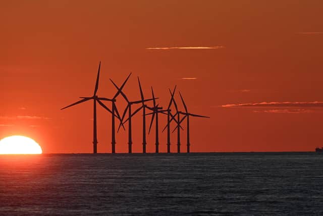 The sun sets behind the Burbo Bank Offshore Wind Farm in Liverpool Bay in the Irish Sea. PIC: PAUL ELLIS/AFP via Getty Images