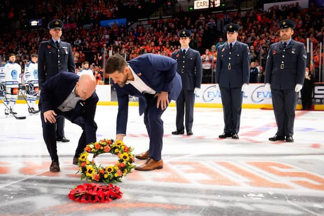 REMEMBERING: Sheffield Steelers' coach Aaron Fox and Coventry Blaze coach Danny Stewart (left) lay a wreath in centre ice at the Utilita Arena. Picture courtesy of Dean Woolley/Steelers Media.