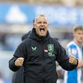 Huddersfield Town head coach Liam Manning celebrates at the final whistle against Bradford City. Photo: Tony Johnson.