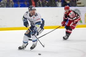 STAYING POSITIVE: Sheffield Steeldogs' defence Tim Smith (above left) in action during the 3-0 defeat at home to Swindon Wildcats last weekend. Picture courtesy of Peter Best/Steeldogs Media