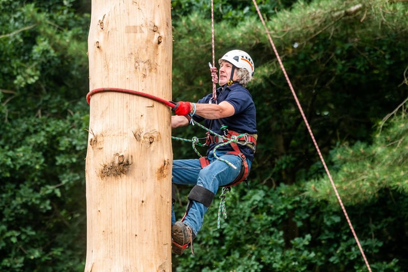 Andy Kirkwood, aged 61, taking part in the Pole Climbing competition