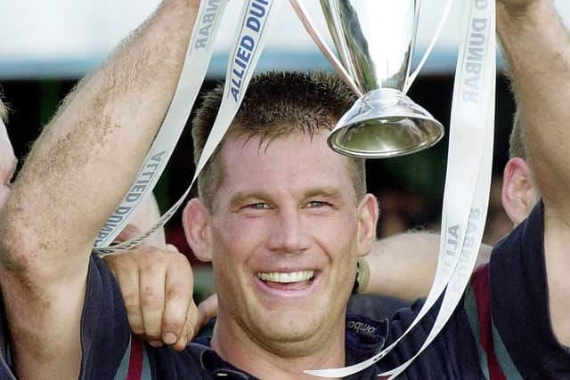 Mike Schmid, Rotherham's captain holds the cup after Rotherham once again won National One, although that year in 2002 they would be denied promotion.
