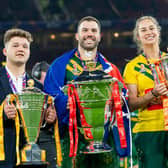 England's Tom Halliwell, Australia's James Tedesco and Kezie Apps with the respective wheelchair, men's & women's Rugby League World Cup trophies. (Photo: Allan McKenzie/SWpix.com)