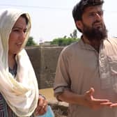 Bradford MP Naz Shah in Pakistan speaking to a survivor of the devastating floods