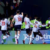 OPENER: Amario Cozier-Duberry (right) celebrates putting Bolton Wanderers 1-0 up (Image: Nigel French/PA Wire)