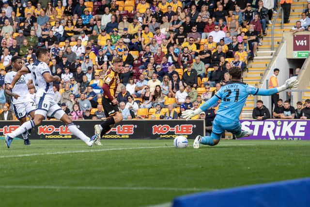 Bradford City's Bobby Pointon sees his shot saved by Mansfield Town keeper - and former Bantams player - Harry Lewis. Photo: Tony Johnson.