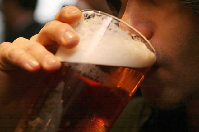 A man drinking a pint of beer in a pub. PIC: Johnny Green/PA Wire