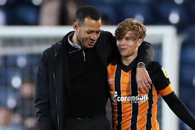 Liam Rosenior, manager of Hull City, speaks with Harry Vaughan at the end of last season (Picture: Lewis Storey/Getty Images)