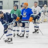 SUPPORT: Sheffield Steeldogs' new player-coach Jason Hewitt (left), pictured on the Ice Sheffield ice on Tuesday night with former Sheffield Steelers' team-mates Liam Kirk (second left) and Rob Dowd (third left). Picture courtesy of Peter Best/Steeldogs Media