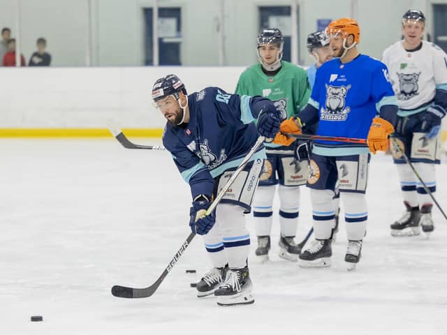 SUPPORT: Sheffield Steeldogs' new player-coach Jason Hewitt (left), pictured on the Ice Sheffield ice on Tuesday night with former Sheffield Steelers' team-mates Liam Kirk (second left) and Rob Dowd (third left). Picture courtesy of Peter Best/Steeldogs Media