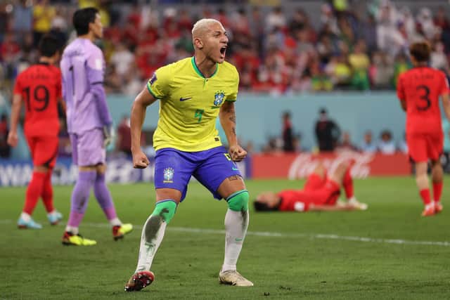 Richarlison celebrates after Lucas Paqueta of Brazil (not pictured) scored their sides fourth goal against South Korea. (Picture: Michael Steele/Getty Images)