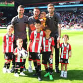 DEPARTING: (Left to right) Oliver Norwood, George Baldock and Chris Basham say goodbye to Sheffield United with their children before the Premier League match against Tottenham Hotspur