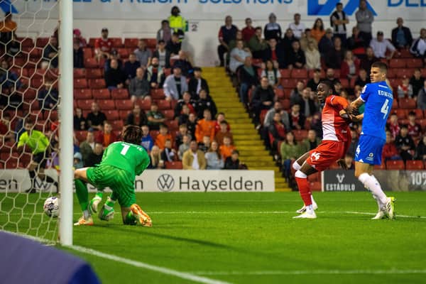 Barry Cotter's shot is deflected off Nicholas Bilokapic for Barnsley's breakthrough versus Peterborough. The visitors turned the tables to win 3-1. Picture: Bruce Rollinson