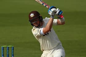 Ollie Pope hits out on his way to a century. Photo by Ben Hoskins/Getty Images for Surrey CCC.