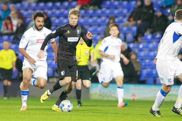 Alex Fisher takes on the Tranmere defence.