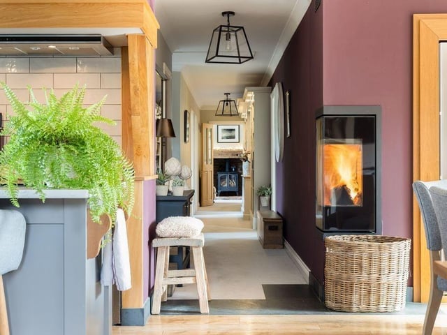 Quartz surfaces, ceramic sink and fitted storage add practicality to the expansive room.