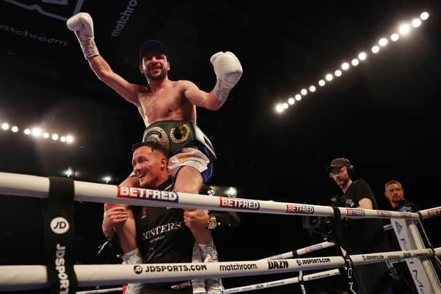 NOTTINGHAM, ENGLAND - SEPTEMBER 24: Maxi Hughes celebrates on the shoulders of Josh Warrington after defeating Kid Galahad in the IBO World Lightweight title fight between Maxi Hughes and Kid Galahad at Motorpoint Arena Nottingham on September 24, 2022 in Nottingham, England. (Photo by Nathan Stirk/Getty Images)
