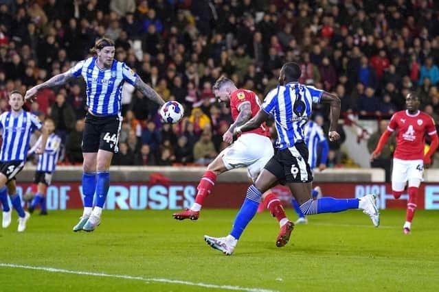 GOAL: Barnsley's James Norwood (centre) pictured scoring against Sheffield Wednesday.