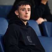 Huddersfield Town loan midfielder Cameron Humphreys watches from the stands during the League One home game with Oxford United - shortly after rejoining. Picture: Jonathan Gawthorpe