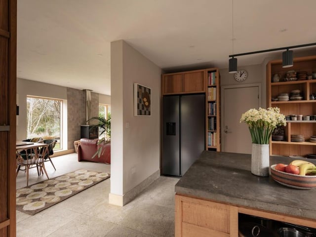 A stainless-steel Mercury cooker and extractor form a striking centrepiece, combining professional-grade function with bold design.