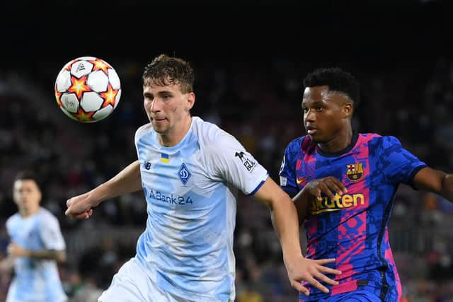 Dynamo Kiev's Ukrainian defender Illia Zabarnyi (L) playing against Barcelona in the Champions League has joined Bournemouth (Picture: LLUIS GENE/AFP via Getty Images)