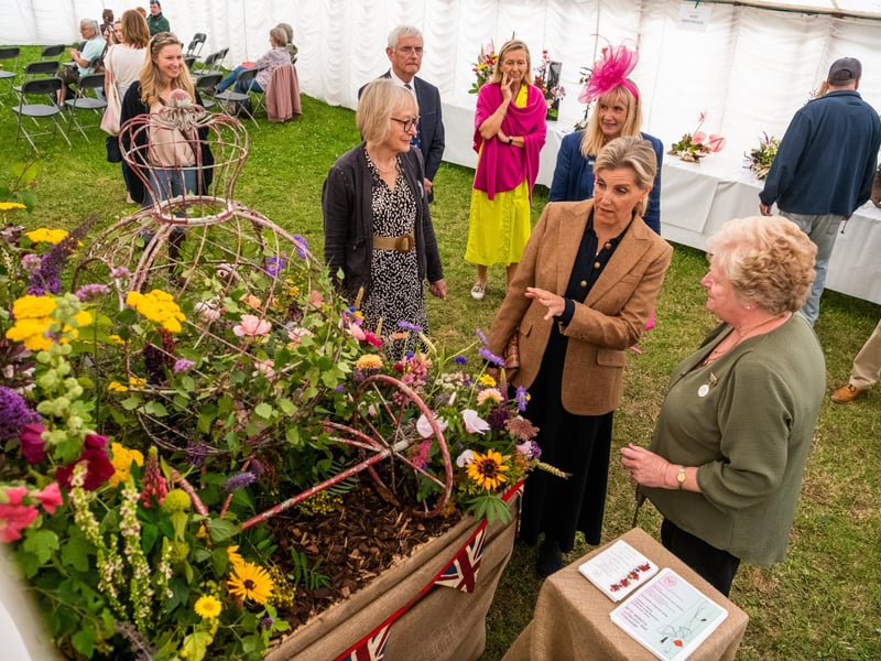The Duchess of Edinbugh admires a floral arrangement as a tribute to the Coronation of King Charles III and Queen Camilla by Driffield Flower Club.