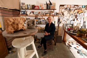 Janie in her workshop with some of her sculpures