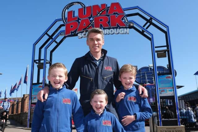 Dane and his children at Luna Park. (Pic credit: Dane Crow)